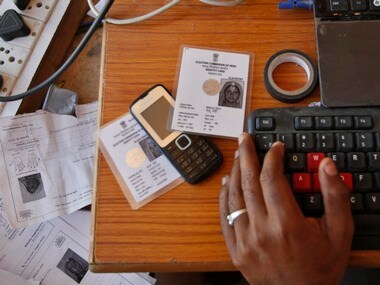 An operator works on his table while enrolling villagers for the Unique Identification (UID) database system for Aadhaar. Reuters.