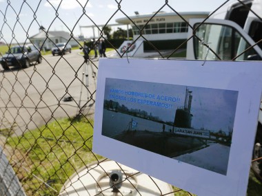 A picture of the Argentine submarine ARA San Juan written in Spanish "Come on steel men. We will wait for you at home" hangs from the fence at the Navel base in Mar del Plata, Argentina. AP