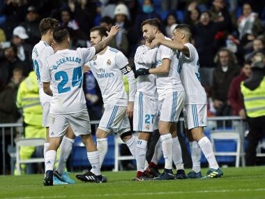 Real Madrid's Borja Mayoral, second right, is congratulated by teammates after scoring his side's first goal against Fuenlabrada. AP