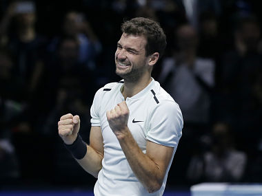 Grigor Dimitrov of Bulgaria celebrates after defeating David Goffin of Belgium in their ATP World Tour Finals singles final tennis match at the O2 Arena in London, Sunday Nov. 19, 2017. (AP Photo/Tim Ireland)