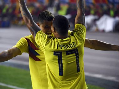 Colombia's Edgar Parado (R) celebrates with teammate Giovanni Moreno after scoring a goal during their international friendly football match against China. AFP