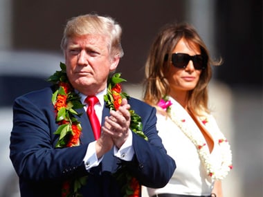 US president Donald Trump walks with first lady Melania Trump in Honolulu. AP