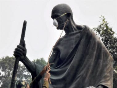 Delhi air pollution: MLAs tie protective masks on Mahatma Gandhis statue to protest AAP govts inaction