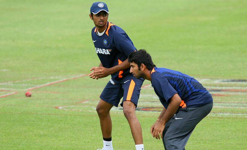 File image of Jaydev Unadkat in his debut series in South Africa, 2010, along side team mate Cheteshwar Pujara. AFP