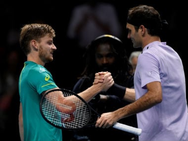 Belgium's David Goffin shakes hands with Switzerland's Roger Federer after winning their semi final match. Reuters