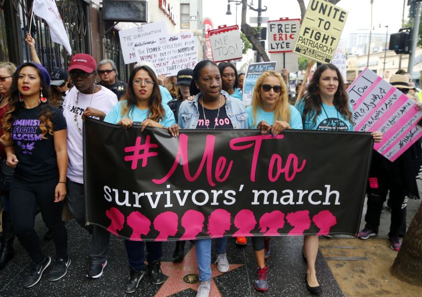 Participants march against sexual assault and harassment at the #MeToo March in the Hollywood section of Los Angeles on Sunday, Nov. 12, 2017. (AP Photo/Damian Dovarganes)