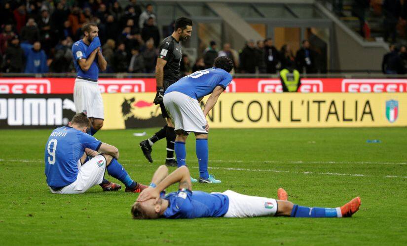 Italy players look dejected after the match against Sweden. Reuters