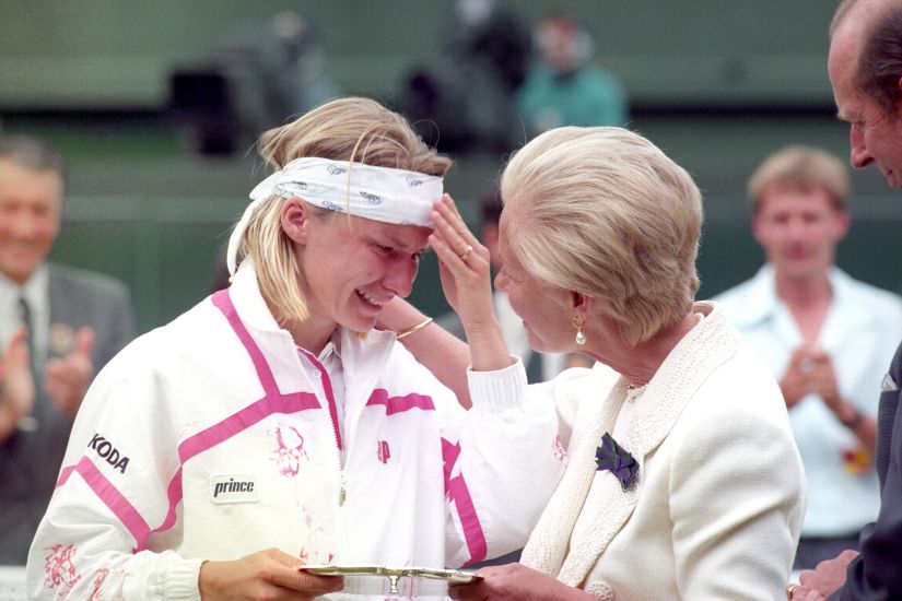 File photo of the Duchess of Kent comforting Jana Novotna as she presents her with the runner up trophy on Centre Court at Wimbledon. Novotna had lost 6-7, 6-1, 4-6 to defending champion Steffi Graf. AP