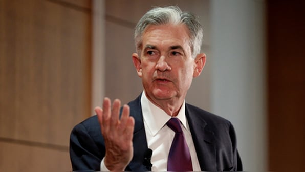 US Federal Reserve raises interest rates to fight inflation, signals more hikes ahead