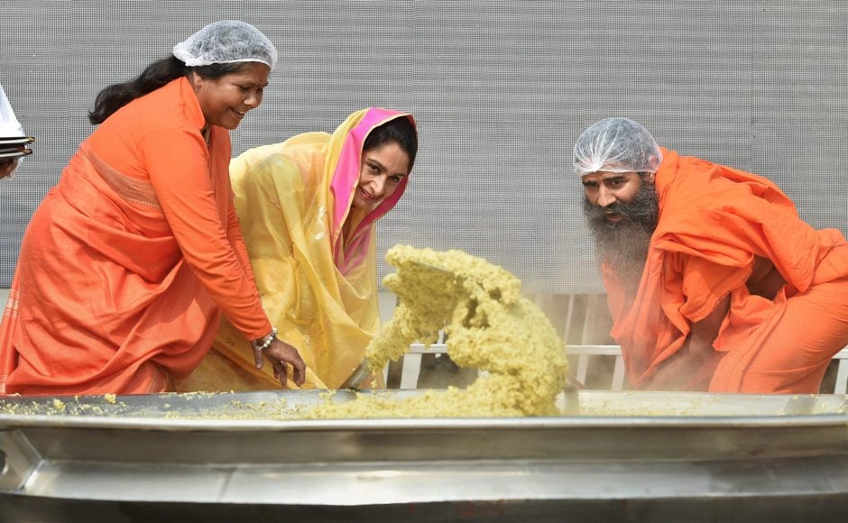 The minimum requirement to set the record was 500 kilograms, however, with the help of over 50 chefs, India managed to cook over 900 kilograms of Khichdi. Badal along with Sadhvi Niranjan Jyoti and Swami Ramdev cooking Khichdi. PTI The minimum requirement to set the record was 500 kilograms, however, with the help of over 50 chefs, India managed to cook over 900 kilograms of Khichdi. Badal along with Sadhvi Niranjan Jyoti and Swami Ramdev cooking Khichdi. PTI