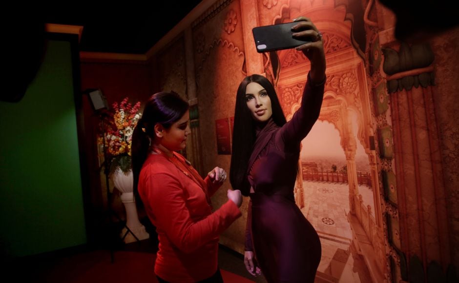 A Madame Tussauds Wax Museum staffer touches the hair of a wax figure of American reality television personality, socialite, actress, businesswoman and model Kim Kardashian. AP A Madame Tussauds Wax Museum staffer touches the hair of a wax figure of American reality television personality, socialite, actress, businesswoman and model Kim Kardashian. AP