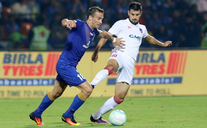 Lucian Goian of Mumbai City FC in action against Bruno Augusto Pelissari De Lima of Delhi Dynamos FC in the 2016 season. ISL