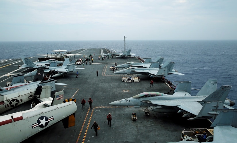 F/A-18 Hornet fighter jets and E-2D Hawkeye plane are seen on the US aircraft carrier John C Stennis during joint military exercise called Malabar, with the United States, Japan and India participating, off Japan's southernmost island of Okinawa, Japan in June 2016. Reuters