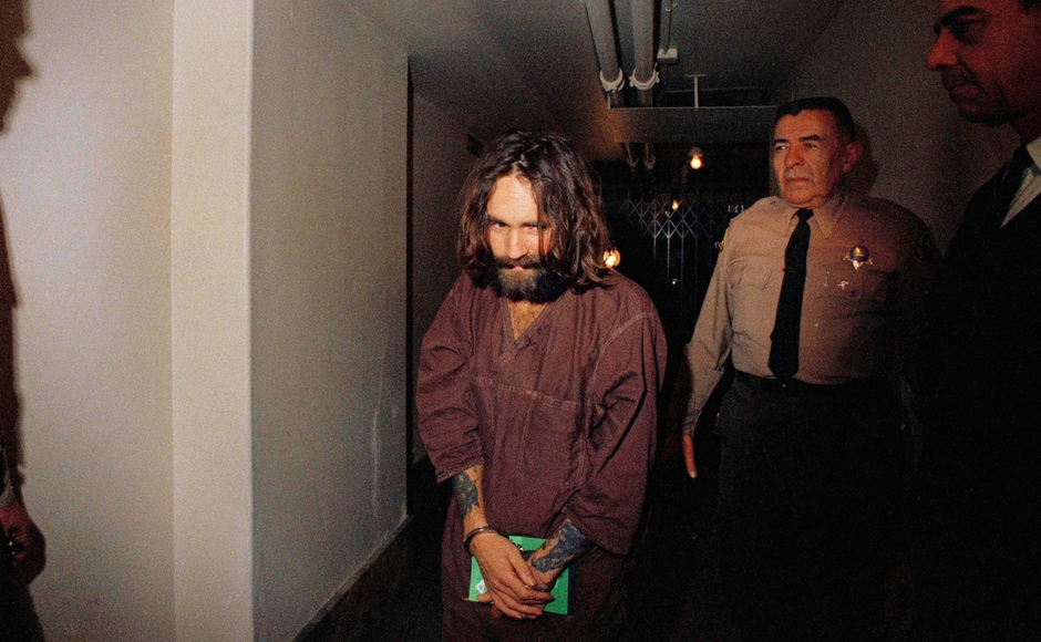 File image of Charles Manson being escorted to court in Los Angeles during an arraignment phase in 1969. Authorities say Manson, cult leader and mastermind behind 1969 deaths of actress Sharon Tate and several others, died on Sunday. He was 83. AP File image of Charles Manson being escorted to court in Los Angeles during an arraignment phase in 1969. Authorities say Manson, cult leader and mastermind behind 1969 deaths of actress Sharon Tate and several others, died on Sunday. He was 83. AP