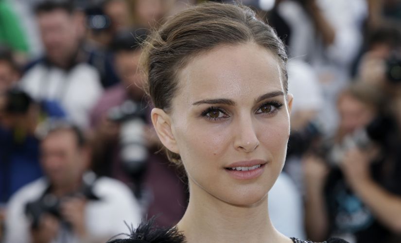 FILE - In this May 17, 2015 file photo, Natalie Portman poses for photographers during a photo call at the 68th international film festival, Cannes, southern France. On Tuesday, Nov. 7, 2017, Natalie Portman was awarded Israel’s 2018 Genesis Prize, a $1 million recognition that is widely known as the “Jewish Nobel Prize.” Organizers of the prize announced Tuesday that they were recognizing the Oscar-winning actress for her commitment to social causes and deep connection to her Jewish and Israeli roots. (AP Photo/Lionel Cironneau, File)