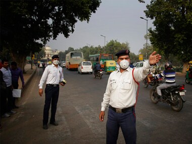 Sharan, a traffic police officer, manages traffic in New Delhi. PTI