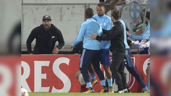 Europa League: Marseille defender Patrice Evra charged with violent conduct by UEFA for kicking fan