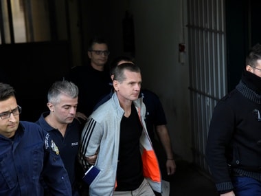 Alexander Vinnik, a 38 year old Russian man (C) suspected of running a money laundering operation using bitcoin. Reuters