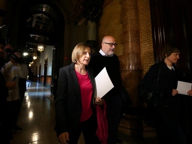 Carme Forcadell, speaker of the Catalan regional Parliament, leave a Parliament board meeting with deputies Lluis Corominas and Anna Simo in Barcelona. Reuters