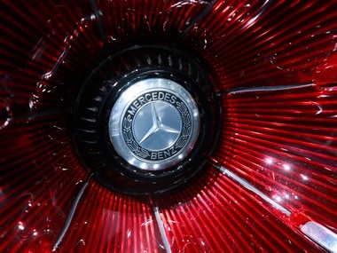 A Mercedes sign is seen on the car before the Daimler annual shareholder meeting in Berlin, Germany. Reuters
