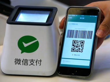 A WeChat Pay system is demonstrated at a canteen. Reuters