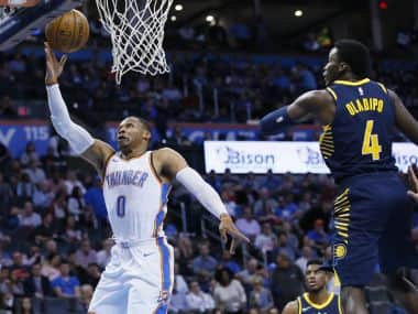 Oklahoma City Thunder guard Russell Westbrook (0) shoots in front of Indiana Pacers guard Victor Oladipo (4) in the third quarter of an NBA basketball game in Oklahoma City, Wednesday, Oct. 25, 2017. Oklahoma City won 114-96. (AP Photo/Sue Ogrocki)