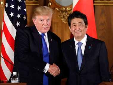 President Donald Trump, left, shakes hands with Japanese Prime Minister Shinzo Abe during a joint news conference on Monday. AP