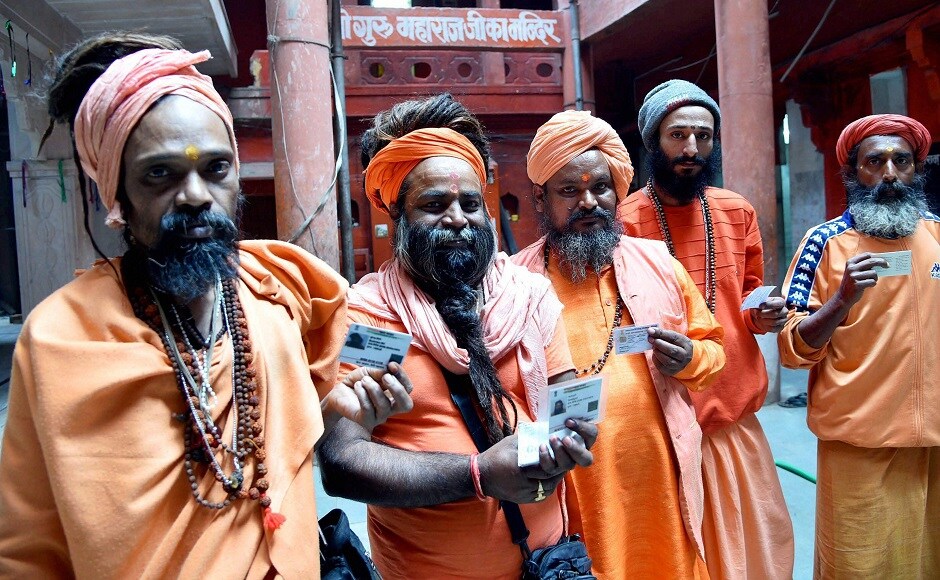 Sadhus display their voter identity cards before casting their votes. About 4,200 policemen, 1,000 home guards and eight companies of Provincial Armed Constabulary have been deployed for poll duty. PTI Sadhus display their voter identity cards before casting their votes. About 4,200 policemen, 1,000 home guards and eight companies of Provincial Armed Constabulary have been deployed for poll duty. PTI