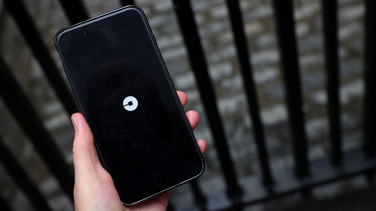 The Uber logo is seen on mobile telephone in London, Britain, September 25, 2017. REUTERS/Hannah McKay - RC18F1F53B00