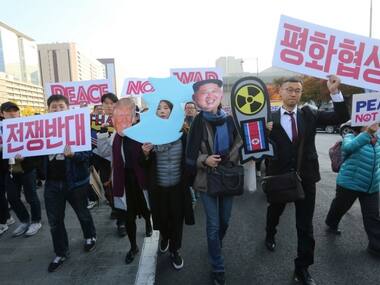 Fearing war with North Korea, hundreds of South Koreans protest Donald Trump's upcoming visit