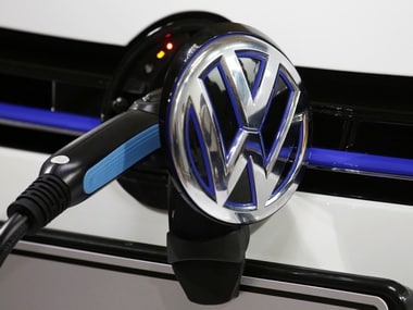A Volkswagen Golf GTE is being charged during a workshop. Image: Reuters