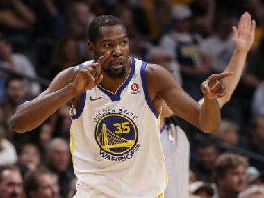 Golden State Warriors' Kevin Durant celebrates after hitting a three-point basket against the Denver Nuggets. AP