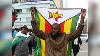 Ecstatic Zimbabweans flood streets of Harare celebrating President Robert Mugabe's expected downfall
