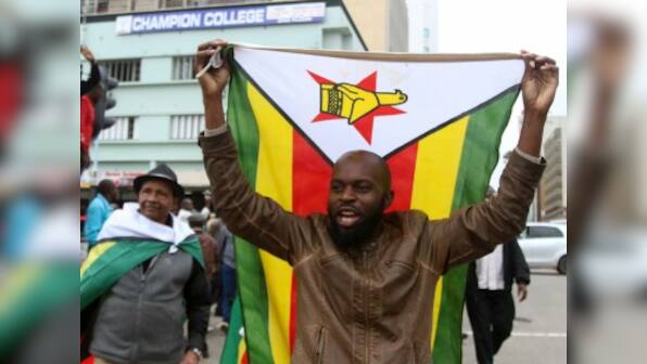 Ecstatic Zimbabweans flood streets of Harare celebrating President Robert Mugabe's expected downfall