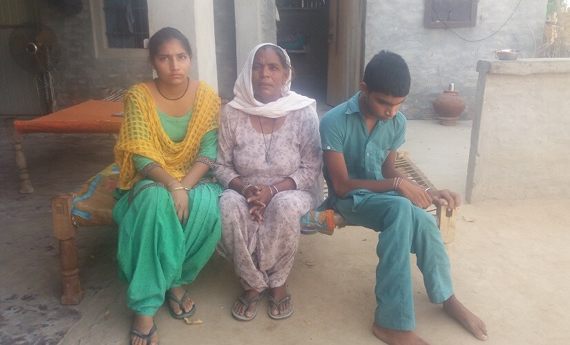 with her family. Image courtesy Sat Singh