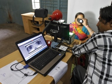 A woman goes through the process of eye scanning for Unique Identification (UID) database system. Reuters
