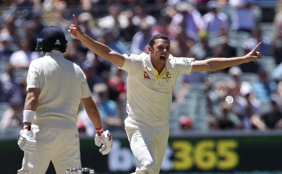 Australia's Josh Hazlewood, right, celebrates the wicket of England's Joe Root, left, caught behind for 67 runs during Day 5. AP Australia's Josh Hazlewood, right, celebrates the wicket of England's Joe Root, left, caught behind for 67 runs during Day 5. AP