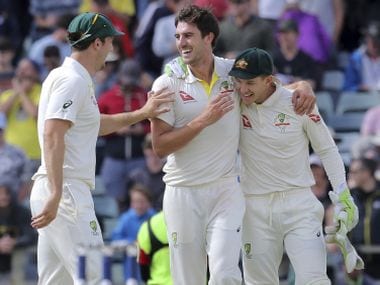Australia’s Mitchell Marsh, left, Pat Cummins and Tim Paine, right, winning the Ashes against England in Perth. AP 