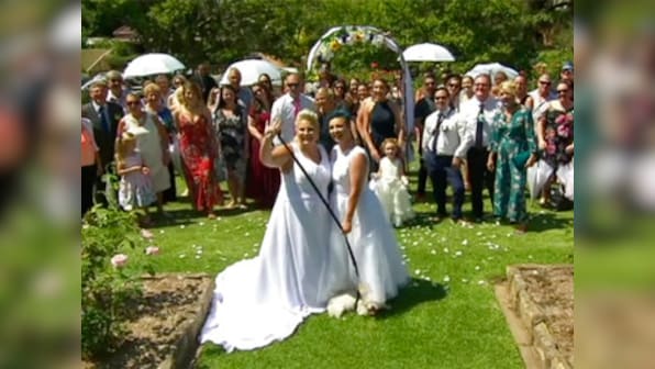 Two female couples tie knot in Australia's first same-sex wedding under new legislation