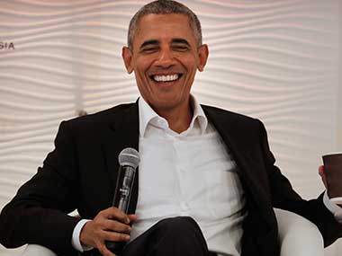 Former US president Barack Obama laughs after answering a question during a leadership summit in New Delhi. AP