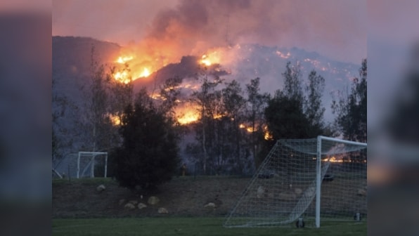 Six wildfires continue to flare in southern California; thousands evacuated as fire crews struggle to contain flames