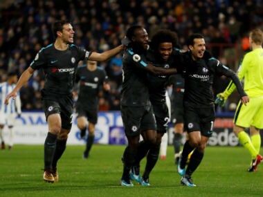 Chelsea's Pedro celebrates scoring their third goal with team mates. Reuters