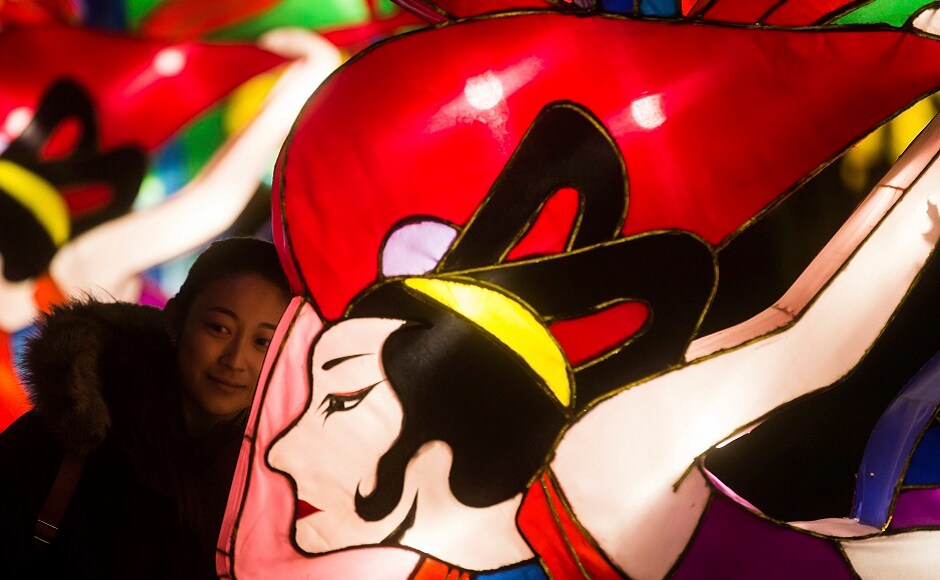 A woman poses next to a lantern during the opening night of the Vancouver Chinese Lantern Festival at the Pacific National Exhibition. AP A woman poses next to a lantern during the opening night of the Vancouver Chinese Lantern Festival at the Pacific National Exhibition. AP