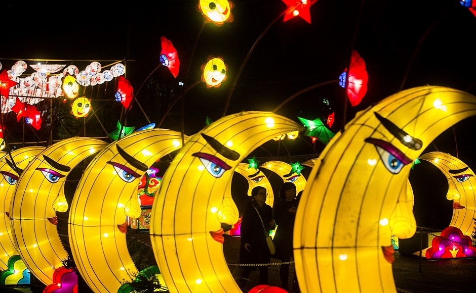 People walk past lanterns in the shape of moons during the opening night of the Vancouver Chinese Lantern Festival at the Pacific National Exhibition, in Vancouver, British Columbia. AP People walk past lanterns in the shape of moons during the opening night of the Vancouver Chinese Lantern Festival at the Pacific National Exhibition, in Vancouver, British Columbia. AP