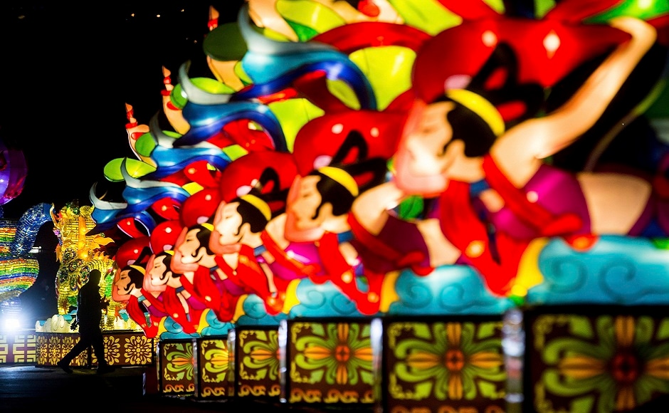 A man is silhouetted while walking past a row of lanterns during the opening night of the Vancouver Chinese Lantern Festival at the Pacific National Exhibition, in Vancouver, British Columbia. AP A man is silhouetted while walking past a row of lanterns during the opening night of the Vancouver Chinese Lantern Festival at the Pacific National Exhibition, in Vancouver, British Columbia. AP