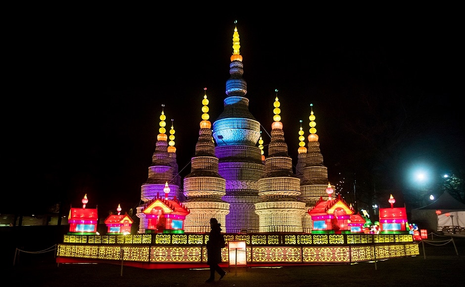 A woman is silhouetted while walking past a pagoda constructed from more than 100,000 porcelain pieces during the opening night of the Vancouver Chinese Lantern Festival at the Pacific National Exhibition, in Vancouver, British Columbia. AP A woman is silhouetted while walking past a pagoda constructed from more than 100,000 porcelain pieces during the opening night of the Vancouver Chinese Lantern Festival at the Pacific National Exhibition, in Vancouver, British Columbia. AP