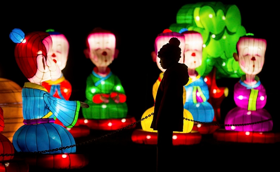 A young girl is silhouetted while viewing lanterns during the opening night of the Vancouver Chinese Lantern Festival at the Pacific National Exhibition, in Vancouver, British Columbia. AP A young girl is silhouetted while viewing lanterns during the opening night of the Vancouver Chinese Lantern Festival at the Pacific National Exhibition, in Vancouver, British Columbia. AP