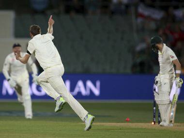 England&rsquo;s Craig Overton, center, celebrates bowling out Australia&rsquo;s Steve Smith, right, for 40 runs during their Ashes Test match in Adelaide. AP