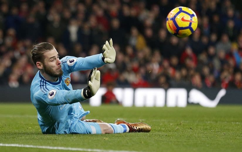 Manchester United’s David de Gea dives to save a shot from Arsenal’s Sead Kolasinac during their English Premier League match. AFP 