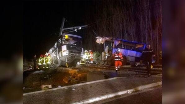 Train ploughs into school bus in Millas, France, severs it into two pieces; four children killed, 20 injured